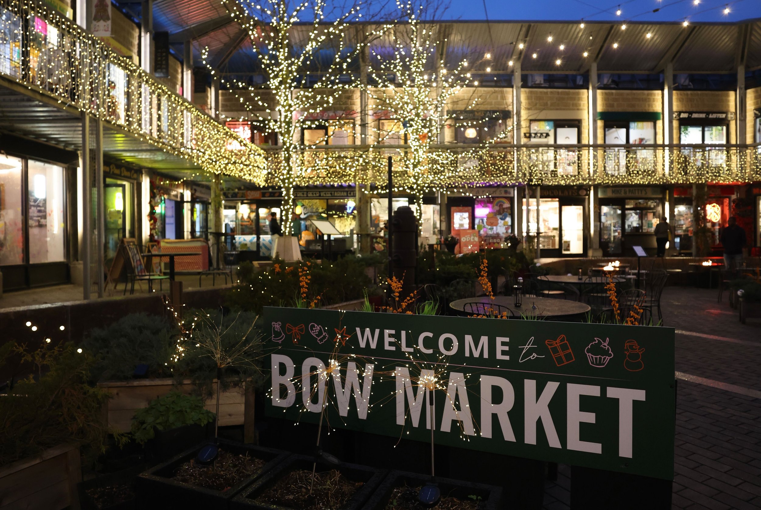 A "Welcome to Bow Market" sign.